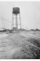 The water tower. 110 feet to the platform and about 30 feet above that. Capacity 300,000 gallons.